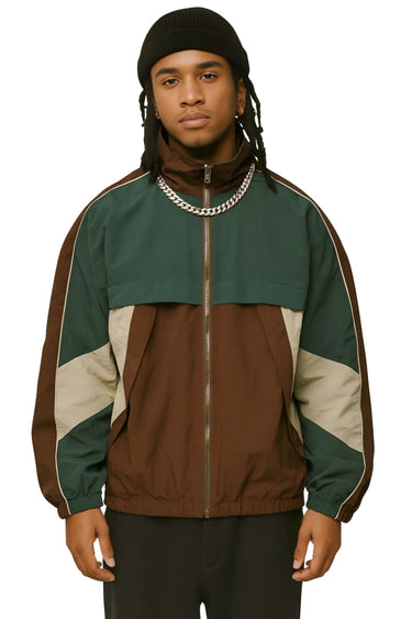 Man wearing a green and brown jacket with a white background